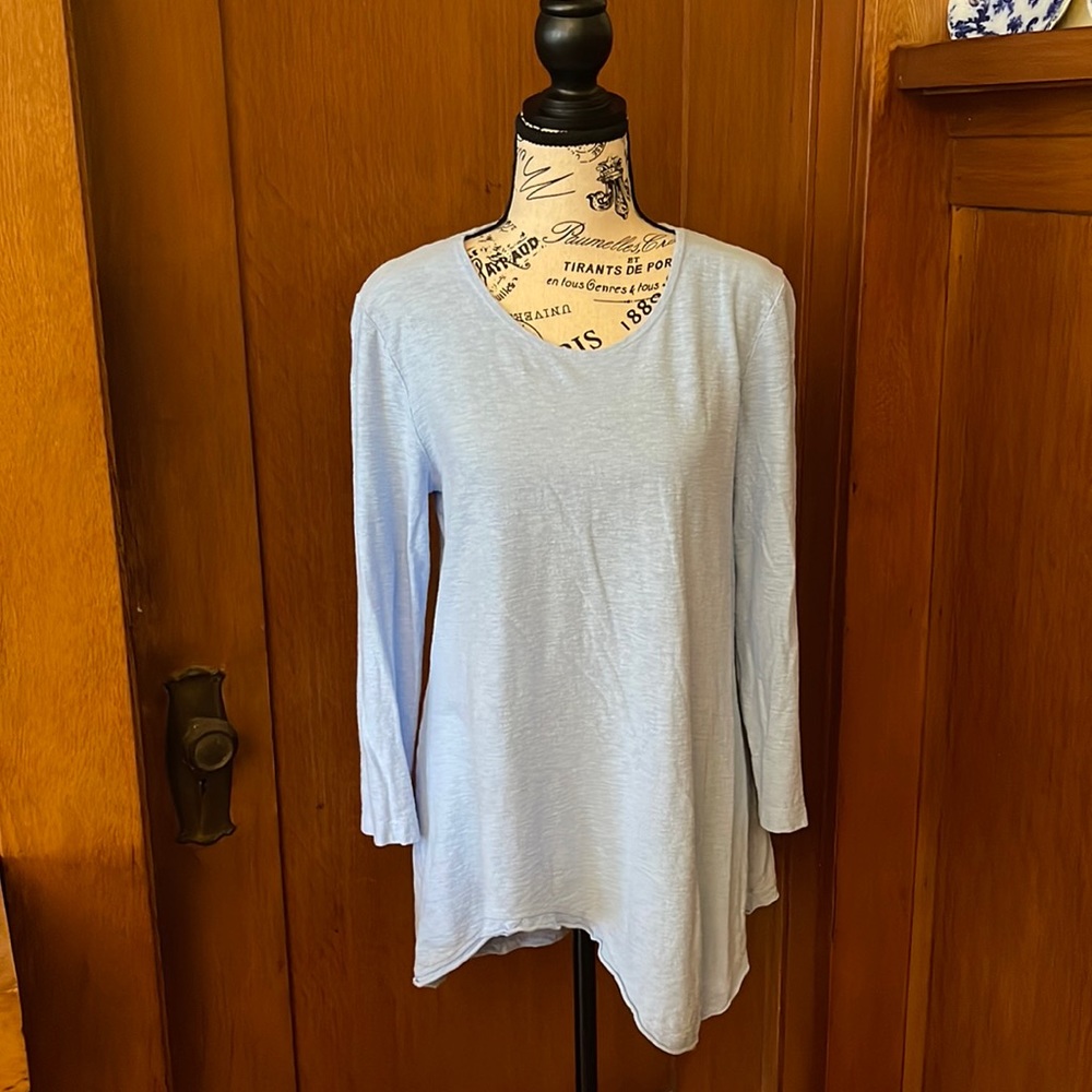 Cut loose tunic asymmetrical hem. Really cute!